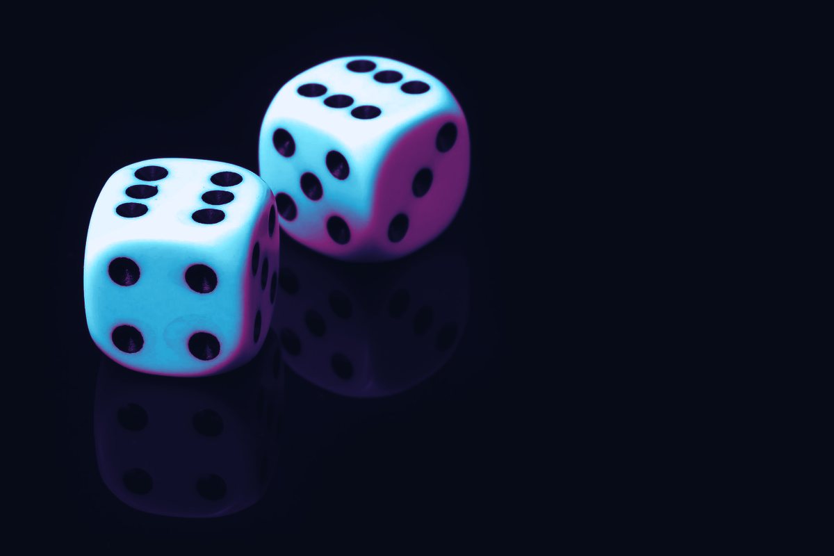 Hard cyan edges of two cubes caught mid-tumble